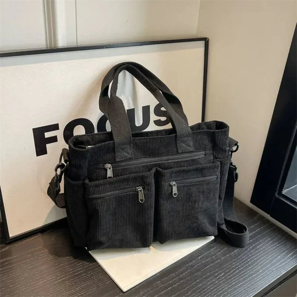 Claire | Cord-Tragetasche mit mehreren Fächern, die sich in eine wandelbare Tasche verwandeln lässt 0